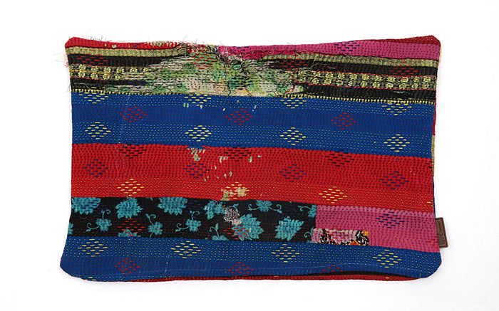 The cushion cover features vibrant colors with red, blue and black stripes, adorned with floral and diamond patterns. Choose the cushion for its unique and handmade look that adds character to any room. Size: 60 x 40 cm.