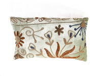 Unique suzani pillowcase 30x50 cm in white and light green with colorful embroidered patterns in rust brown and dark blue for boho ethnic sari pillow