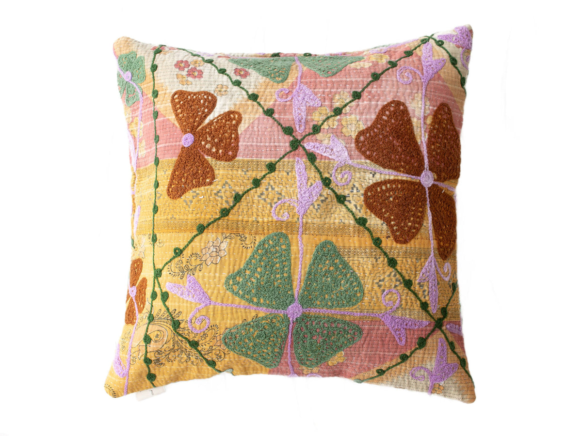 Suzani pillowcase 50x50 in vintage boho style with colorful patchwork in pink, yellow, green and purple as well as oriental embroidered ornaments.